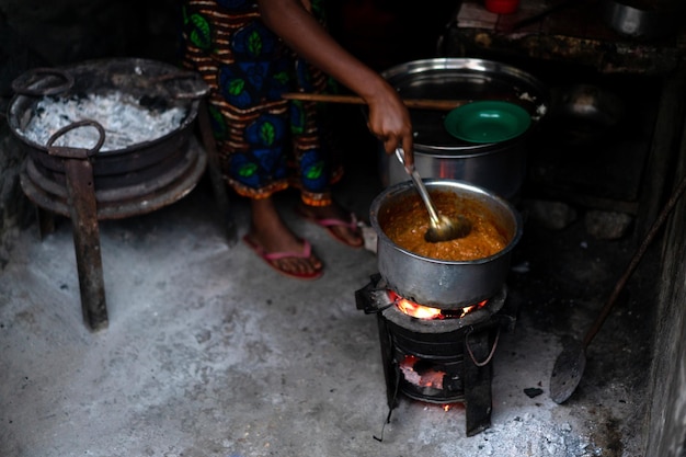 Women cooking traditional food outdoors in the street. High quality photo