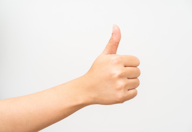 Women hand thumb up on white background