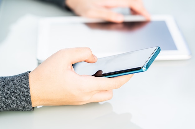 Women hands holding phone with screen above