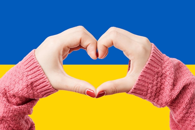 Women hands making a heart shape on a white isolated background Premium Photo