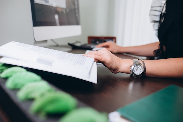 Women hands in office business computer without face