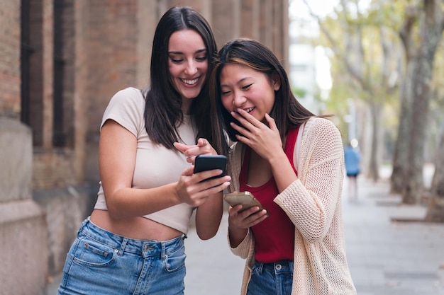 Women having fun with their cell phones