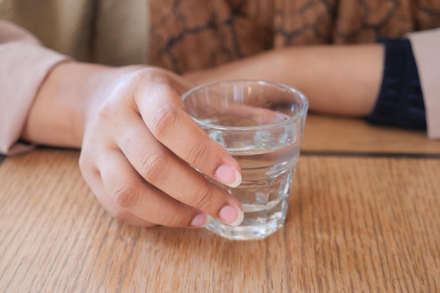 Women holding a glass of water