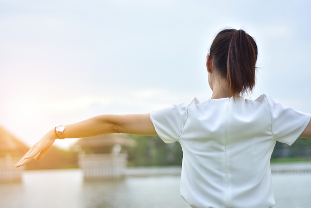 Women on morning at river sunset