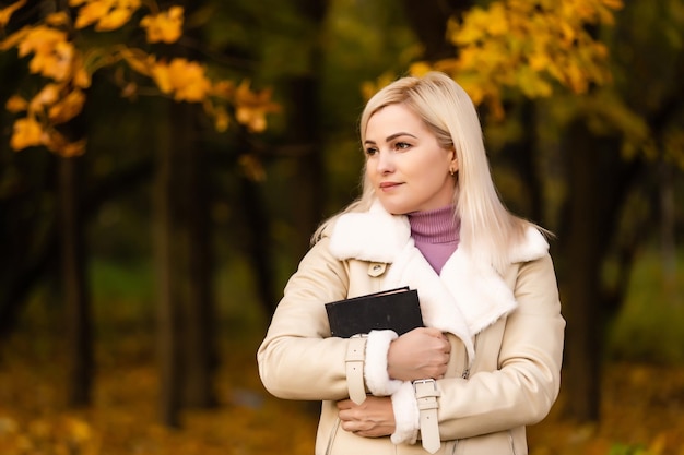 Women in outdoors reading Bible. Concept for faith, spirituality and religion. Peace, hope