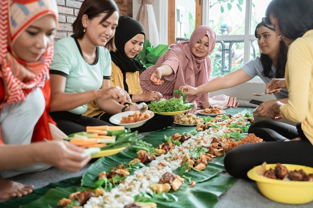 Women preparing for dinner with friends at home