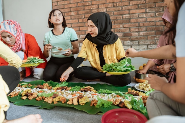 Women preparing for dinner with friends at home