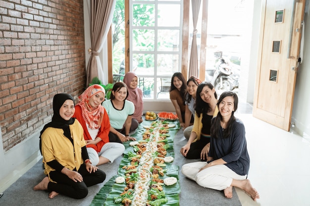 Women preparing for dinner with friends at home