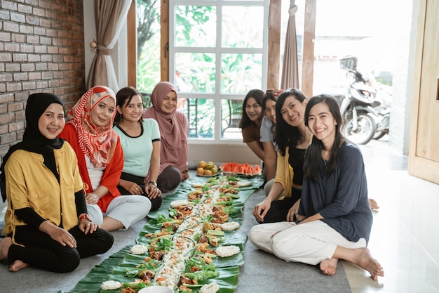 Women preparing for dinner with friends at home