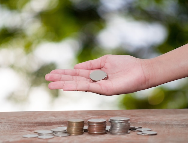 women put coin stack money for money