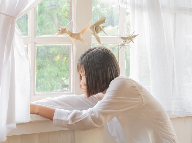 Women relax. And windows Evening and soft light