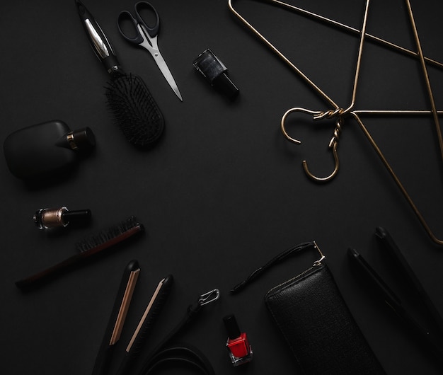 Women's accessories on black background