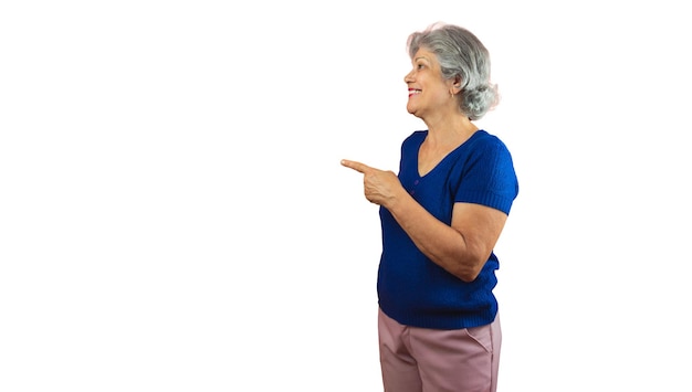 Women's Day Smiling Mature Woman Pointing Isolated on Orange Background