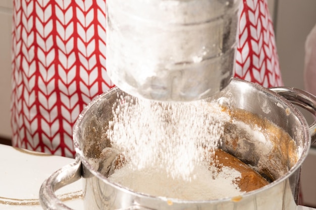 Women's hands knead the dough brown