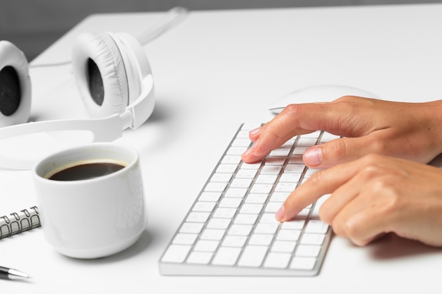 Women's hands using keyboard and mouse