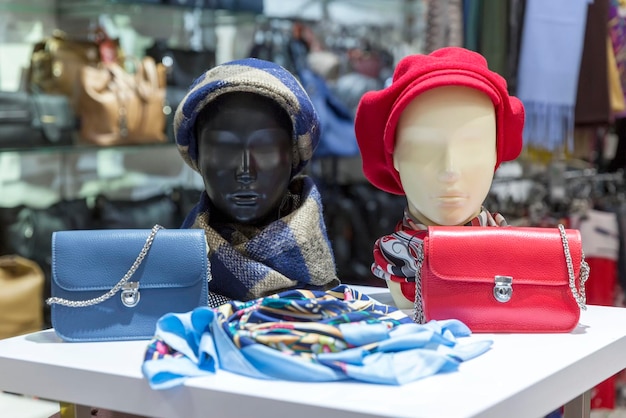 Women's hats and bags on mannequins in an accessories store Fashion Style Closeup