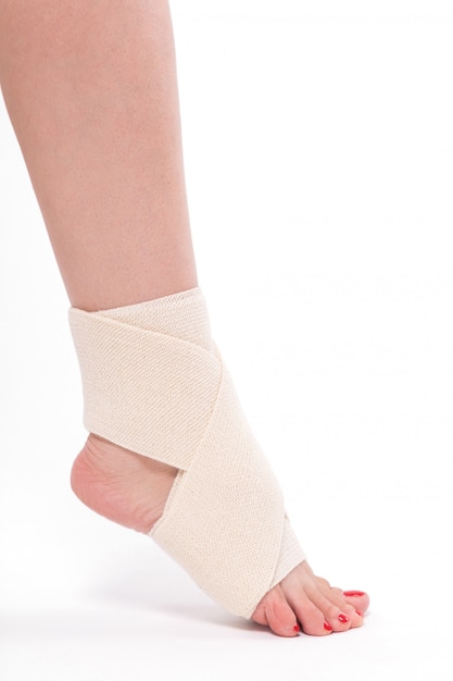 Women's leg tied with an elastic bandage