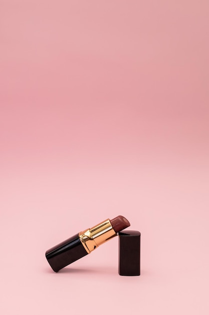 Women's lipstick on a pink background