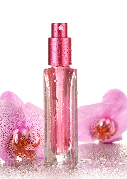 Women's perfume in beautiful bottle and orchid flowers isolated on white