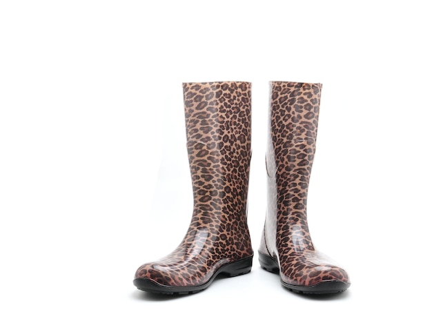 Women's rubber boots with leopard patterns on an isolated white background