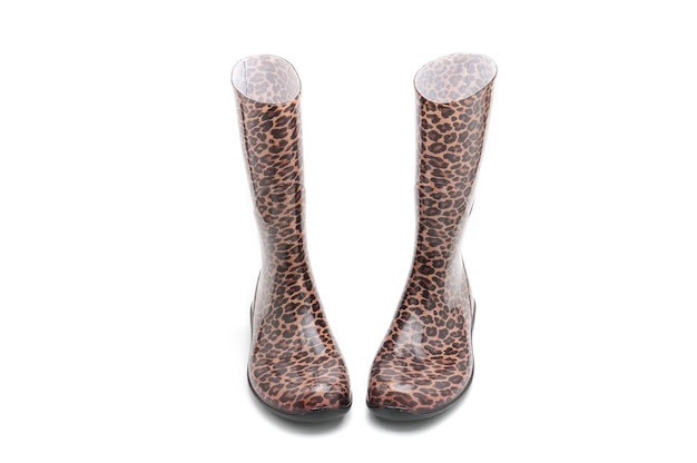 Women's rubber boots with leopard patterns on an isolated white background