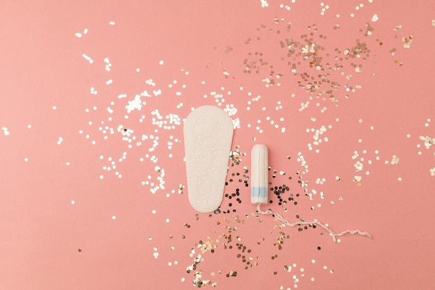 Women's tampons on a pink background