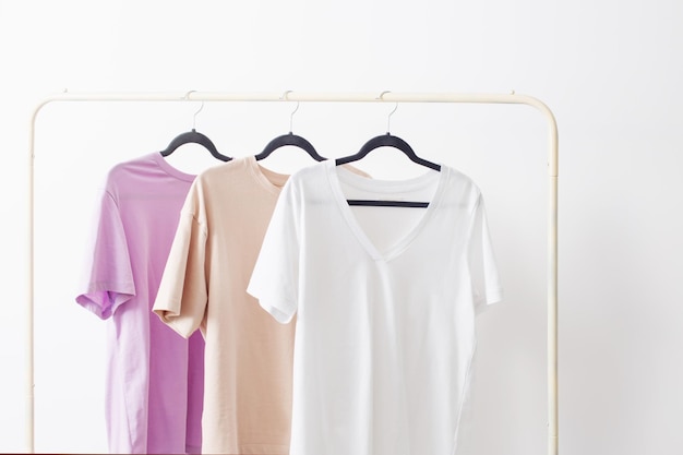 Women's tshirts on hanger on white background