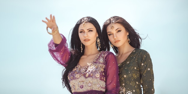 women sisters traveling in desert