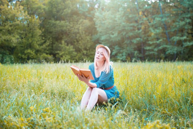 Women tourists read books in calm nature.