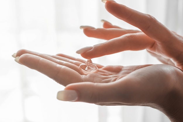 Women washing hands with antibacterial sanitizer gel. Hygiene concept. Prevent the spread of germs and bacteria and avoid infections corona virus.