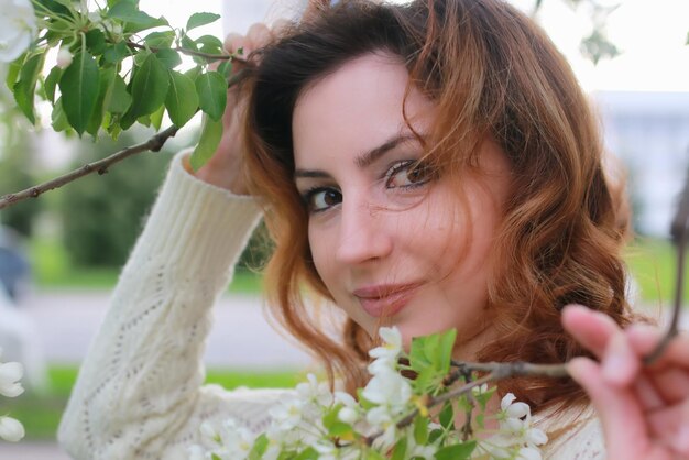 Women with branch apple flower