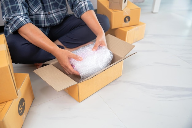 Women working freelance and packing box