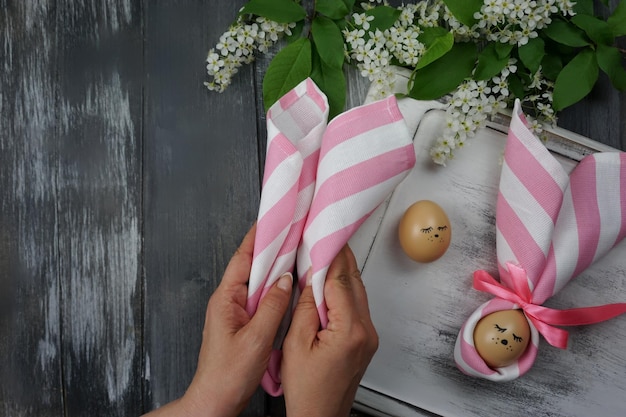 Women39s hands decorate Easter eggs