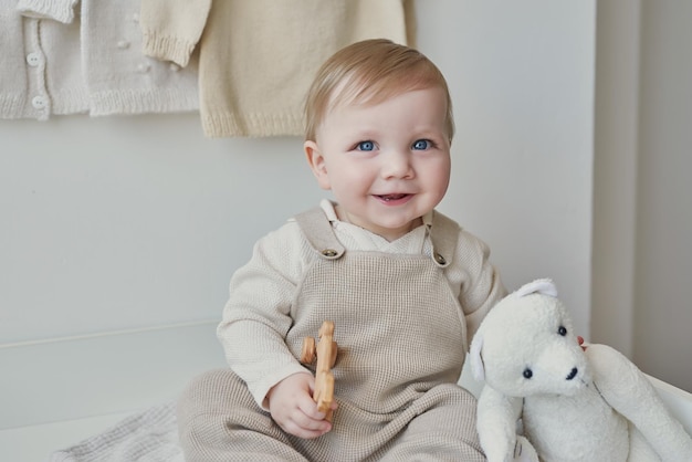 Wonderful baby boy with blue eyes Child playing with toys in nursery Early development kindergarten nursery playroom Children's Day Mother's Day