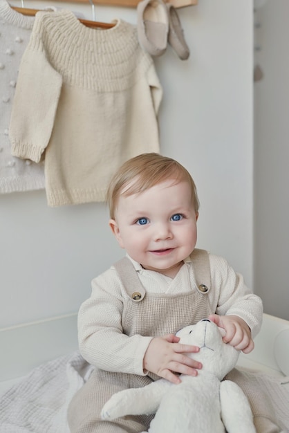 Wonderful baby boy with blue eyes Child playing with toys in nursery Early development kindergarten nursery playroom Children's Day Mother's Day