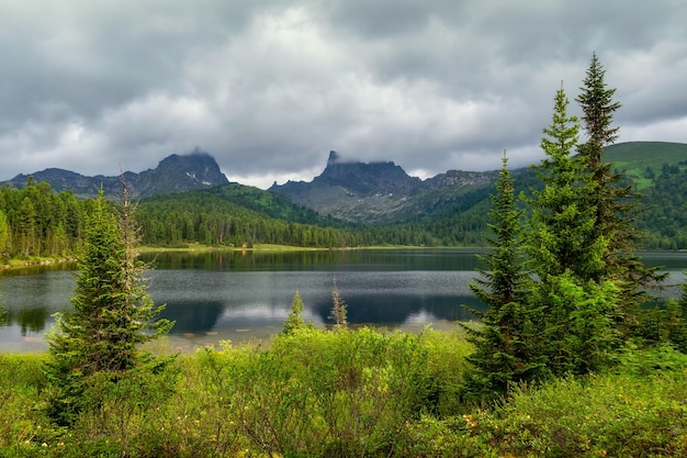 Wonderful giant mountains Big glacier mountain lake Shine water in highlands Amazing atmospheric landscape of majestic nature West Sayans