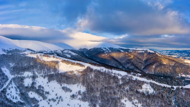 Wonderful landscapes of the Carpathian mountains covered with the first snow in Ukraine near the village of Pylypets