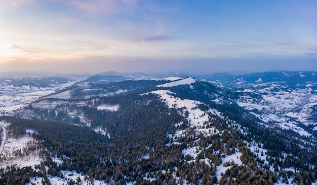 Wonderful landscapes of the Carpathian mountains covered with the first snow in Ukraine near the village of Pylypets