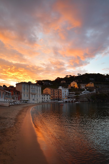 Wonderful sunrise on the beach of the Bay of Silence in Liguria a dream atmosphere