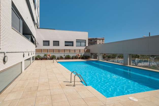 Wonderful view of the swimming pool with clear water near the hotel on sunny warm summer day while