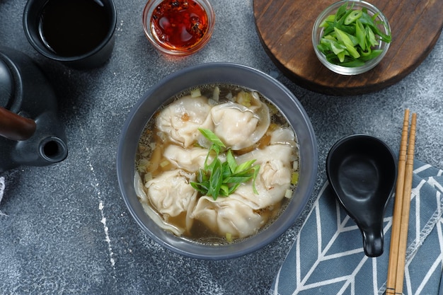 wonton soup with chili oil and green onion,chinese food,asian food style