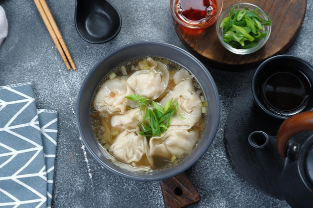 wonton soup with chili oil and green onion,chinese food,asian food style