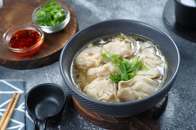 wonton soup with chili oil and green onion,chinese food,asian food style