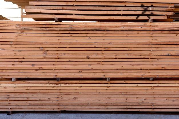 Wood boards piled up in the warehouse of a carpentry