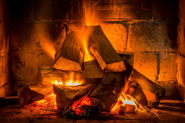 Wood burning in a cozy fireplace at home, keep warm.