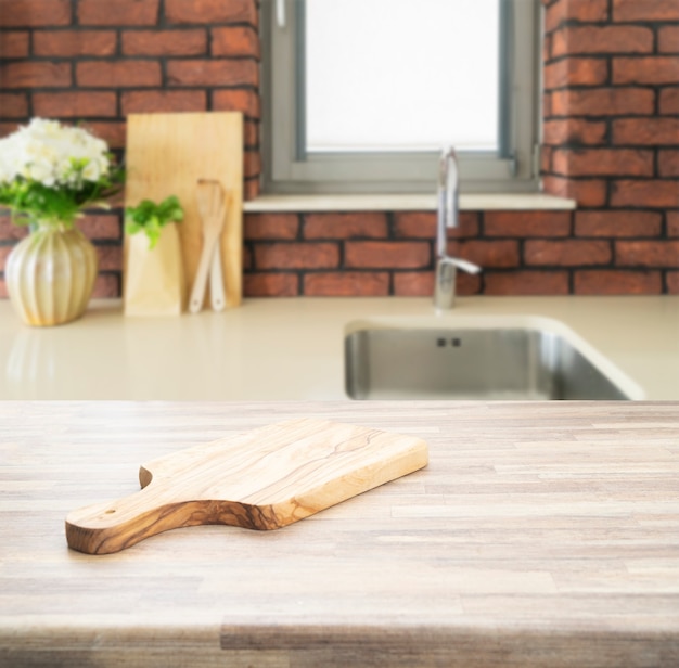 Wood counter top on blur kitchen room background. For montage product display or key visual layout.