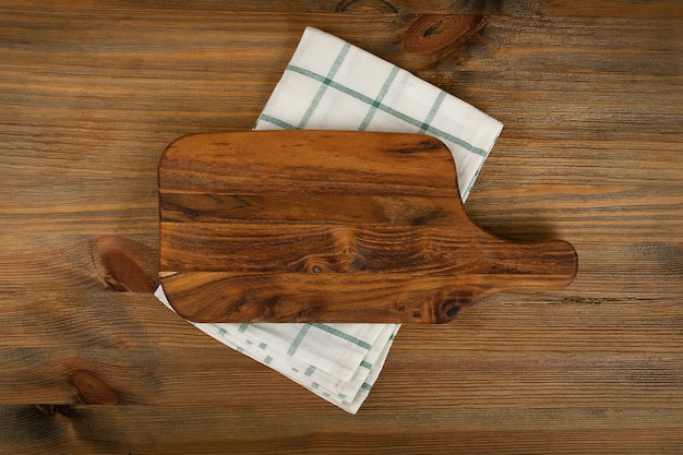 Wood cutting board with napkin mockup top view