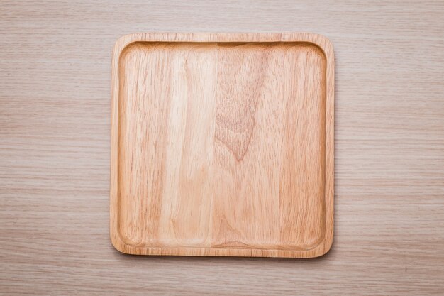 Wood dish on the wooden background. 