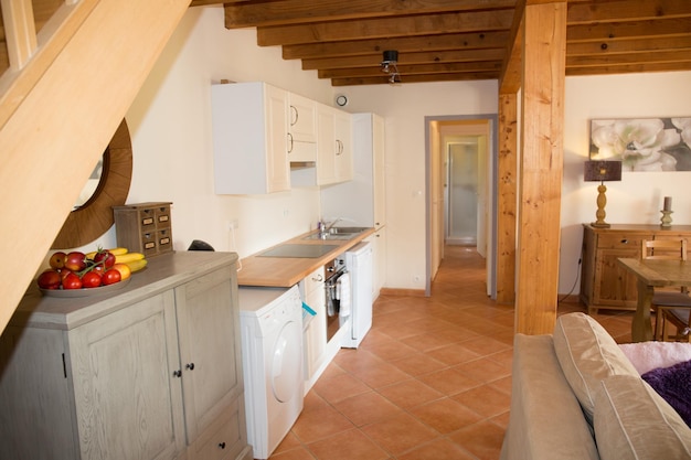 Wood house with open kitchen in white color