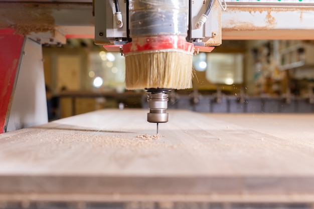 Wood, metal, production concept - the cutting instrument, focus at the cutting process.